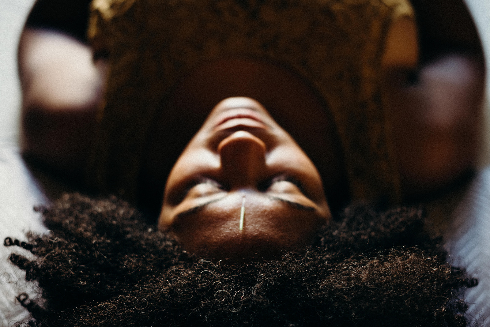 Woman relaxing during acupuncture session for stress and anxiety relief in Portland, Oregon